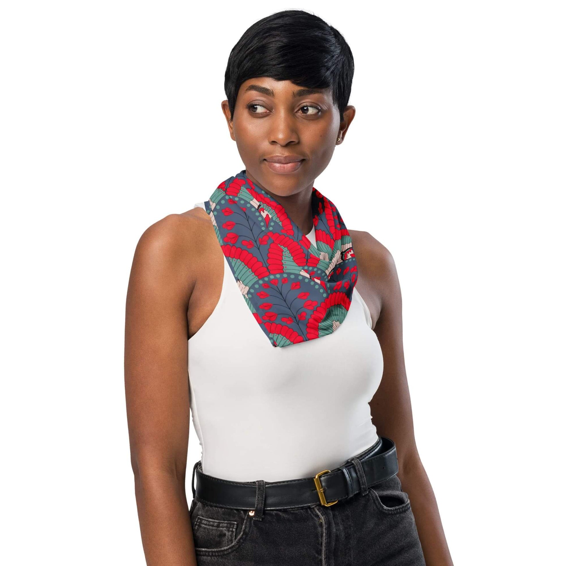 Woman wearing a colorful scallop pattern red navy bandana scarf on a white background