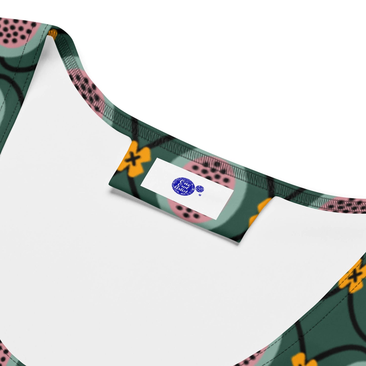 Colorful patterned green tank top with one owl artist brand label
