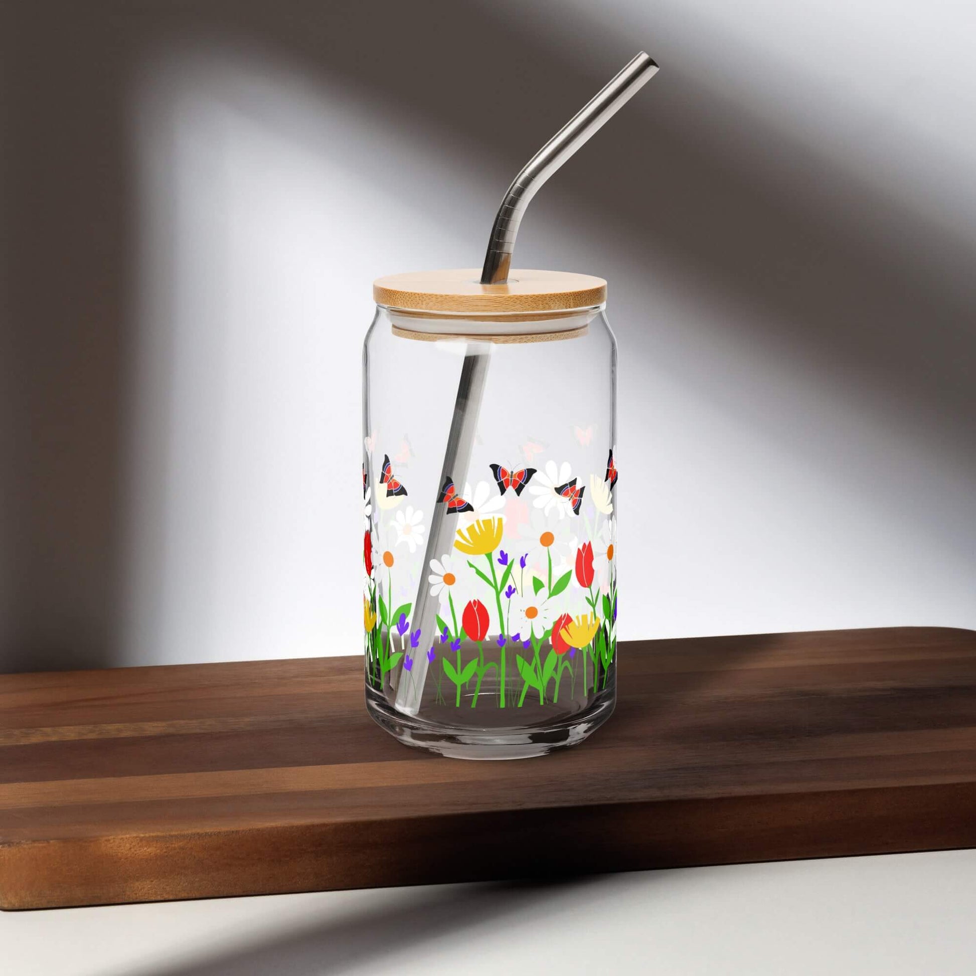 can shaped glass with floral design by one owl artist