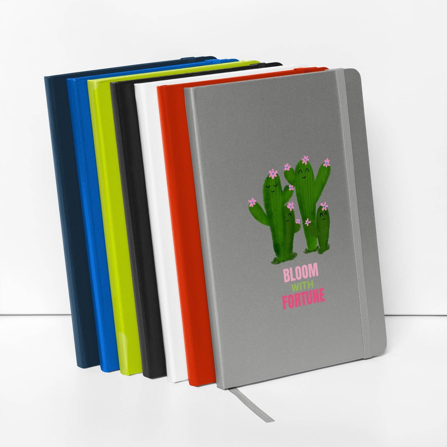 Set of colorful hardcover bound notebooks with a cactus illustration
