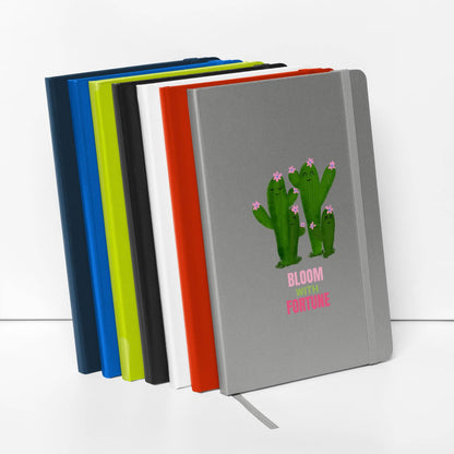 Set of colorful hardcover bound notebooks with a cactus illustration