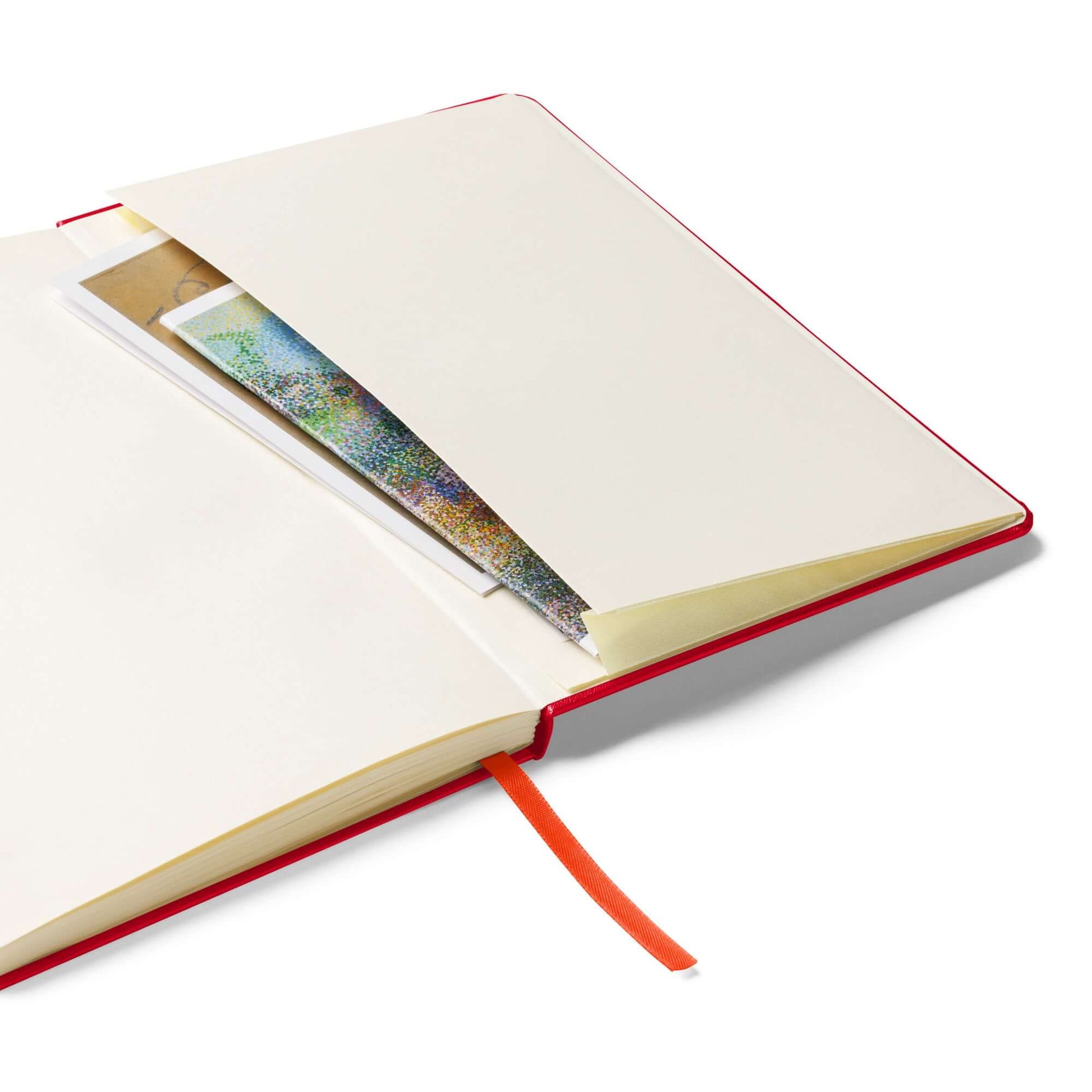 Open hardcover bound notebook with a pocket inside on a white background