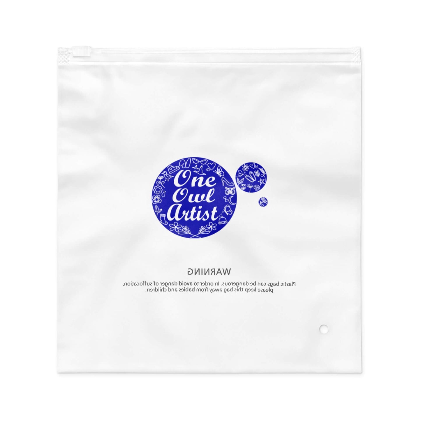 Clear plastic bag with 'One Owl Artist' branding for a plaid dog leash 